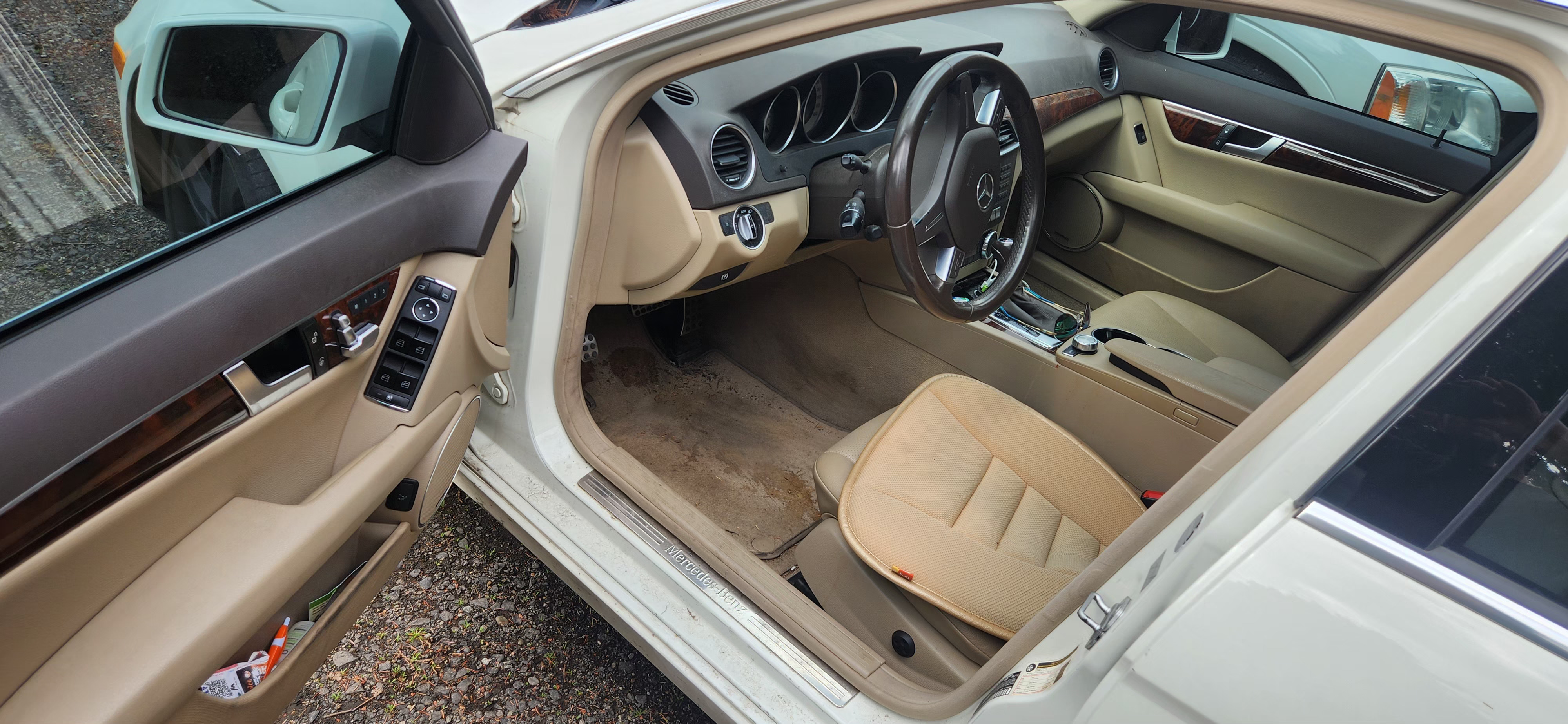 Mercedes C-Class interior before H2D detail — dirty tan carpet and leather